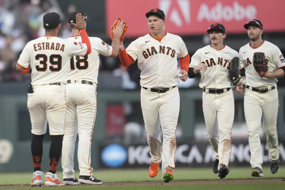 San Francisco Giants' Thairo Estrada (39) celebrates with shortstop Paul DeJong (18), Joc Pederson, center, Wade Meckler, second from right, and Austin Slater after the Giants defeated the Atlanta Braves in a baseball game in San Francisco, Sunday, Aug. 27, 2023. (AP Photo/Jeff Chiu)