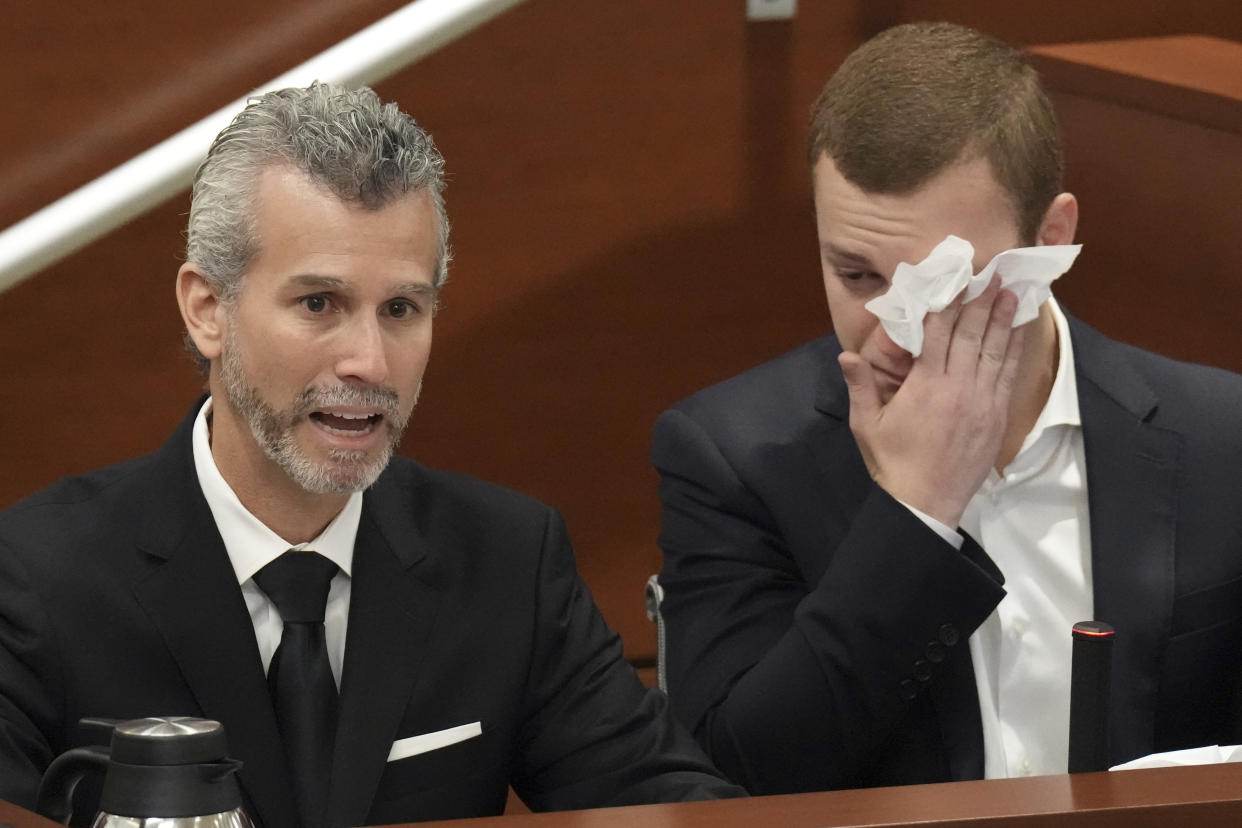 Max Schachter, with his son, Ryan, by his side, gives his victim impact statement during the penalty phase of the trial of Marjory Stoneman Douglas High School shooter Nikolas Cruz at the Broward County Courthouse in Fort Lauderdale, Fla., Wednesday, Aug. 3, 2022. Max's son, and Ryan's brother, Alex, was killed in the 2018 shootings. Cruz previously plead guilty to all 17 counts of premeditated murder and 17 counts of attempted murder in the 2018 shootings. (Amy Beth Bennett/South Florida Sun Sentinel via AP, Pool)