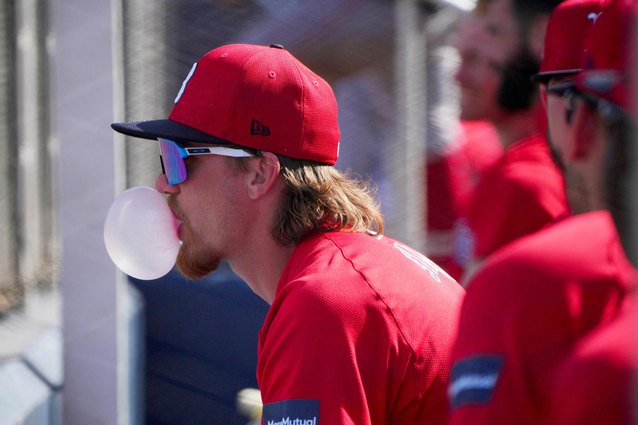 Feb 28, 2024; West Palm Beach, Florida, USA;  Boston Red Sox shortstop Trevor Story (10) blows a bubble gum bubble during the game against the against the Washington Nationals at The Ballpark of the Palm Beaches. Mandatory Credit: Jim Rassol-USA TODAY Sports