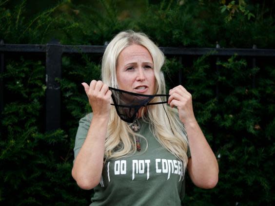 ‘Cassie Sunshine’ wears a g-string on her face as she speaks at the ‘Keep Britain Free’ protest (Getty Images)