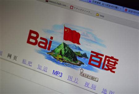 A photo illustration shows a graphic depicting a Chinese national flag flying atop of the disputed islands, called Senkaku by Japan and Diaoyu by China, being seen on the front page of Chinese search engine website Baidu, on a computer screen in Beijing, in this September 18, 2012 file photo. REUTERS/Stringer/Files