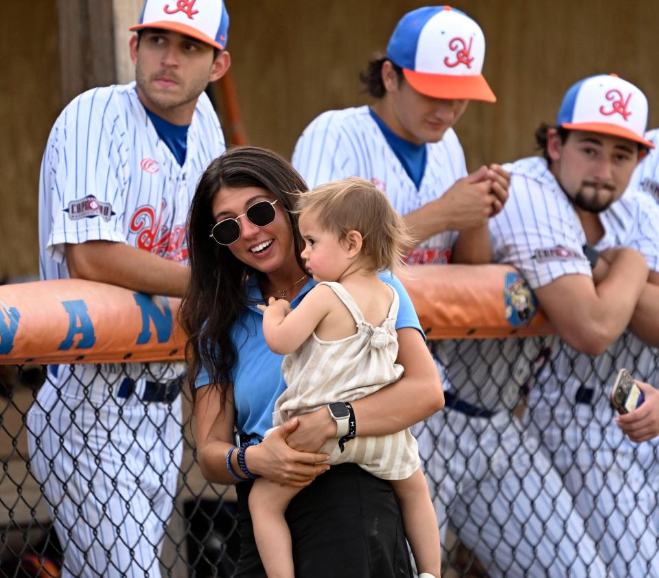 The family of the Hyannis Harbor Hawks GM Nick Johnson, Courtney and Addie, 2, prior to the game with Y-D waiting for him to throw out the first pitch. Members of the Harbor Hawks will be joining kids July 27 at the FunBox in Hyannis,