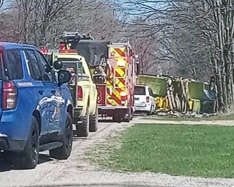 The lime green Litchfield fire truck can be seen on the right side of this photo taken at the scene.