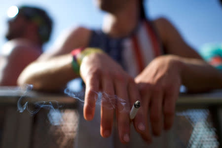 A man smokes at the Firefly Music Festival in Dover, Delaware U.S., June 16, 2018. REUTERS/Mark Makela
