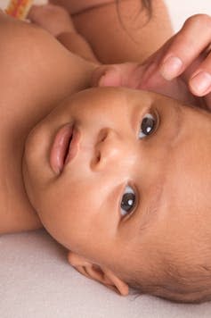 <span class="caption">At three months, most babies can’t sit up properly.</span> <span class="attribution"><a class="link " href="https://www.shutterstock.com/image-photo/biracial-mix-hispanic-black-african-american-39099073?src=PNXo7MeLuRpuMmASso4sCg-1-21" rel="nofollow noopener" target="_blank" data-ylk="slk:OLJ Studio/Shutterstock;elm:context_link;itc:0;sec:content-canvas">OLJ Studio/Shutterstock</a></span>