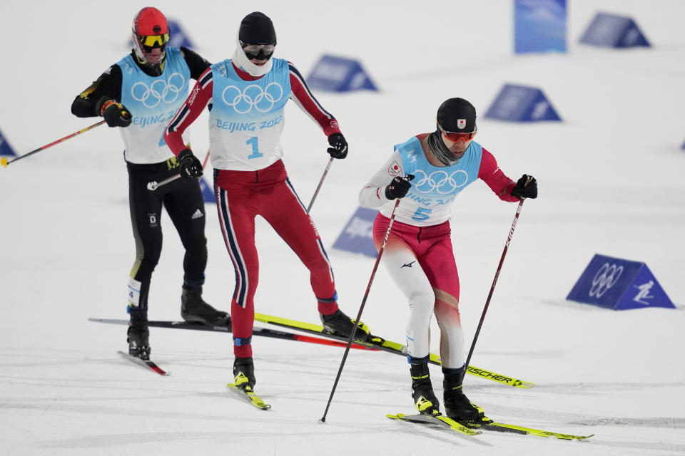 From left, Germany's Manuel Faisst, Norway's Jarl Magnus Riiber and Japan's Akito Watabe compete during the cross-country skiing portion of the individual Gundersen large hill/10km competition at the 2022 Winter Olympics, Tuesday, Feb. 15, 2022, in Zhangjiakou, China. (AP Photo/Aaron Favila)