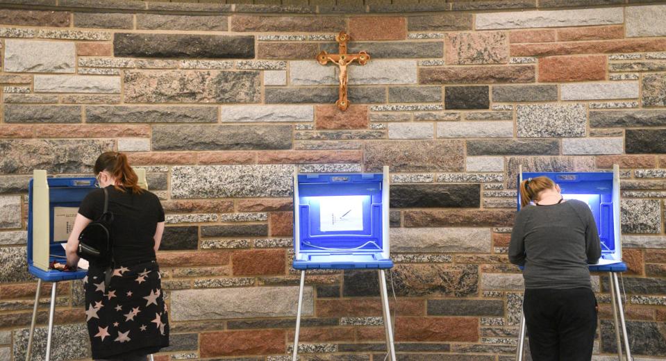 Voters cast their ballots at St. Michaels Catholic Church Tuesday, Nov. 3, 2020, in St. Cloud.