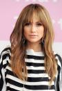 <p>Bring a Brigitte Bardot-esque touch to your shaggy long locks with wispy bangs. Just make sure to blow them out after shampooing — frizzy bangs are the opposite of what you want with this look.</p>