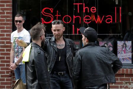 People gather outside the Stonewall Inn in the Greenwich Village neighborhood of New York City, May 9, 2016. REUTERS/Brendan McDermid