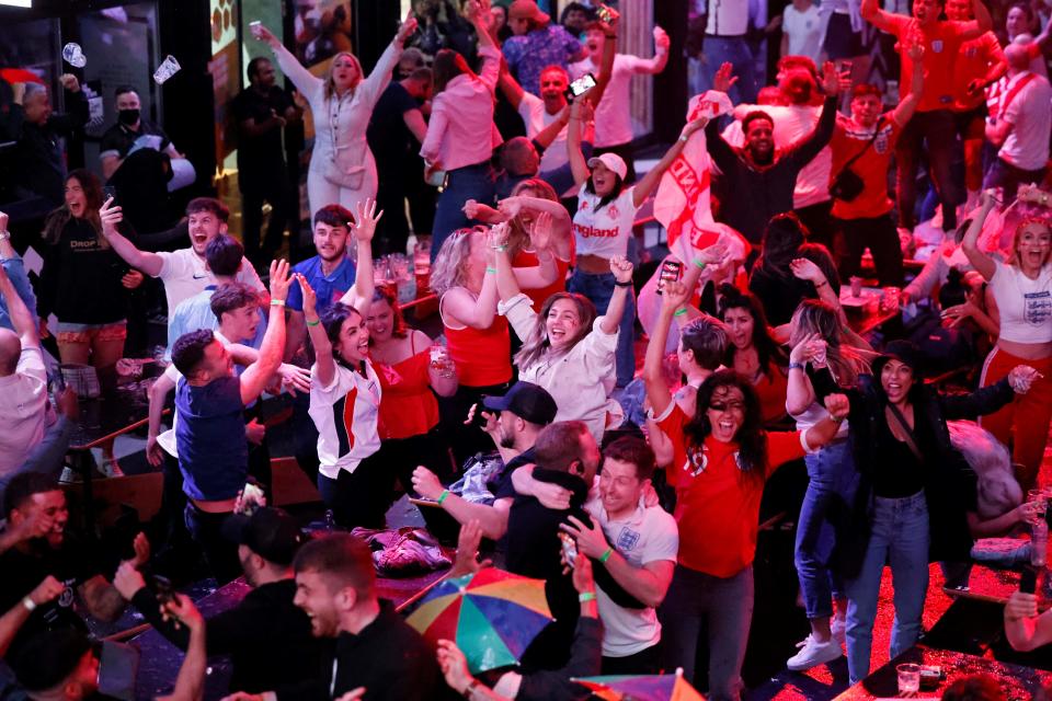 Supporters celebrate England's penalty and second goal at Boxpark Croydon. 