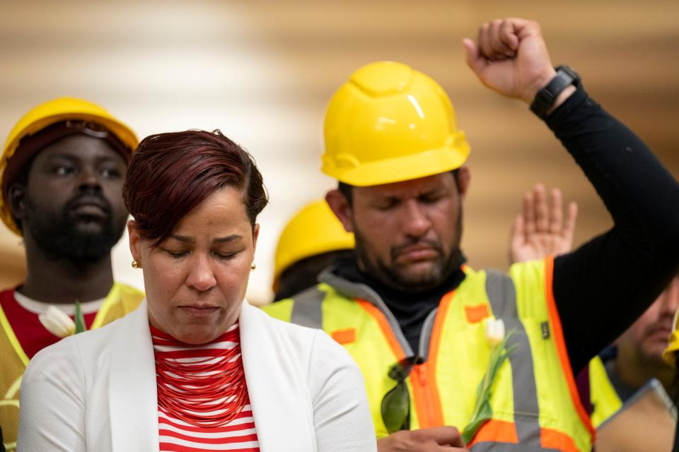 Dyana Forester (center left), senior director of labor relations for Governor Wes Moore, gets emotional during a press conference on March 29, 2024 in Baltimore, MD. The event, hosted by CASA of Maryland, provided Latino construction workers an opportunity to voice their concerns after the Francis Scott Key Bridge in Baltimore, MD, collapsed. Six Latino road construction workers were working on the bridge at the time, only two of whom were rescued.