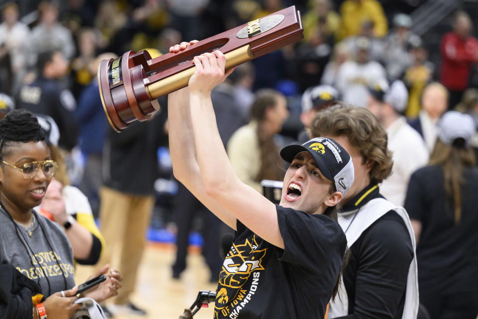 Iowa guard Caitlin Clark celebrates after win against Louisville in the Elite 8 (Caean Couto / AP)