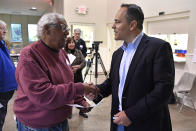 Kentucky Governor and Republican gubernatorial candidate Matt Bevin, right, shakes hands with a poll worker after casting his ballot in the state's general election in Louisville, Ky., Tuesday, Nov. 5, 2019. (AP Photo/Timothy D. Easley)