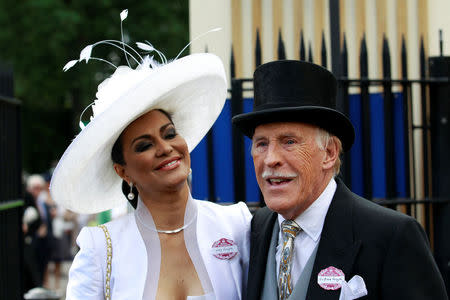 Sir Bruce and his wife Wilnelia arrive for Ladies Day at Ascot