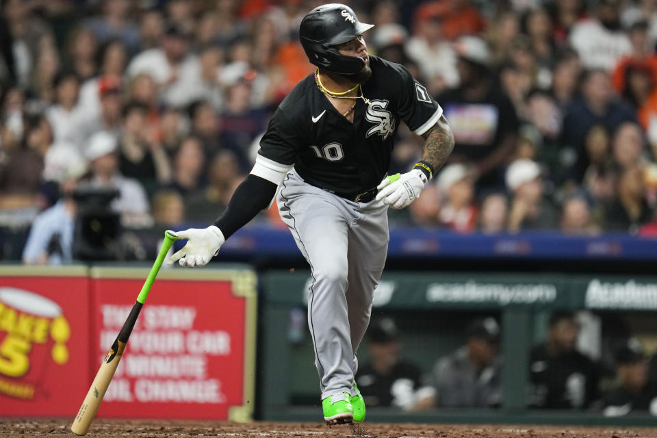 Chicago White Sox's Yoan Moncada watches his RBI double against the Houston Astros during the sixth inning of a baseball game Friday, March 31, 2023, in Houston. (AP Photo/Eric Christian Smith)