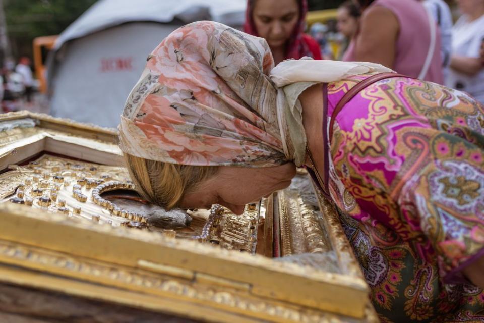 A woman prays at the Transfiguration Cathedral after Russian missile strike in Odesa, Ukraine, on July 23, 2023. (Photo by Andre Alves/Anadolu Agency via Getty Images)