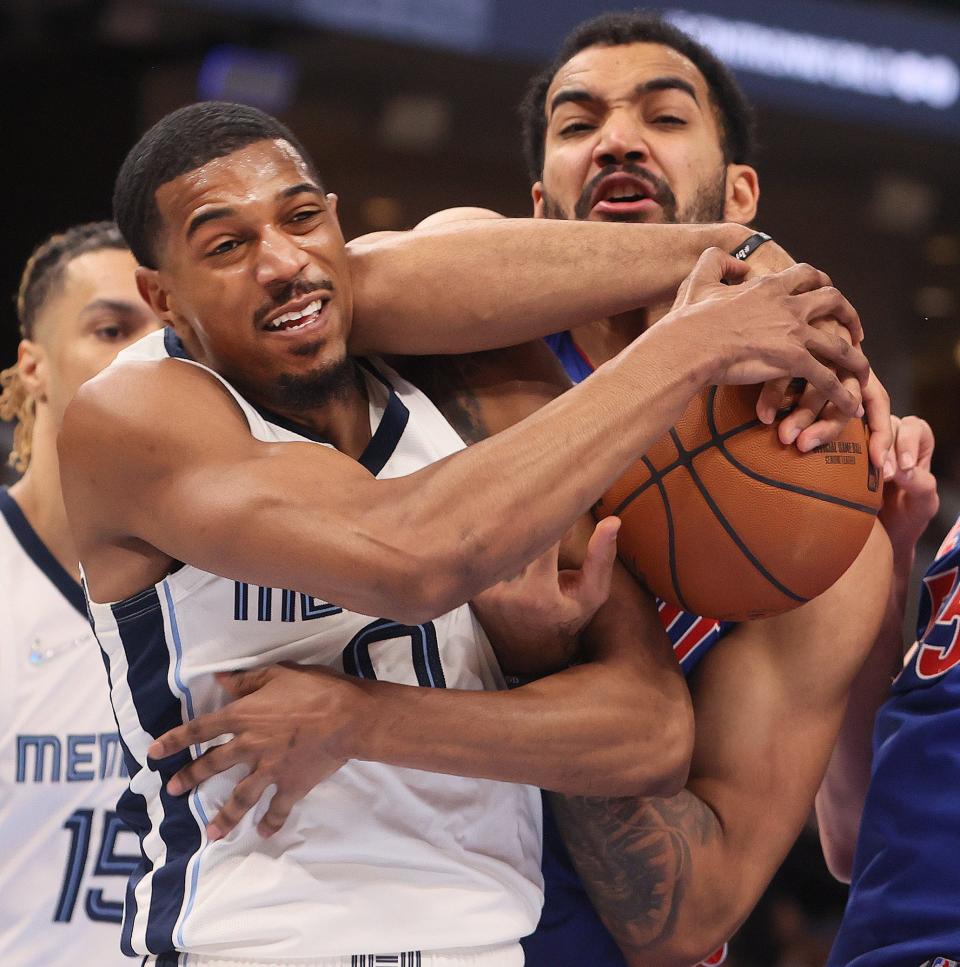 Memphis Grizzlies guard De'Anthony Melton fights for a rebound with Detroit Pistons forward Trey Lyles at FedExForum on Thursday, Jan. 6, 2022.