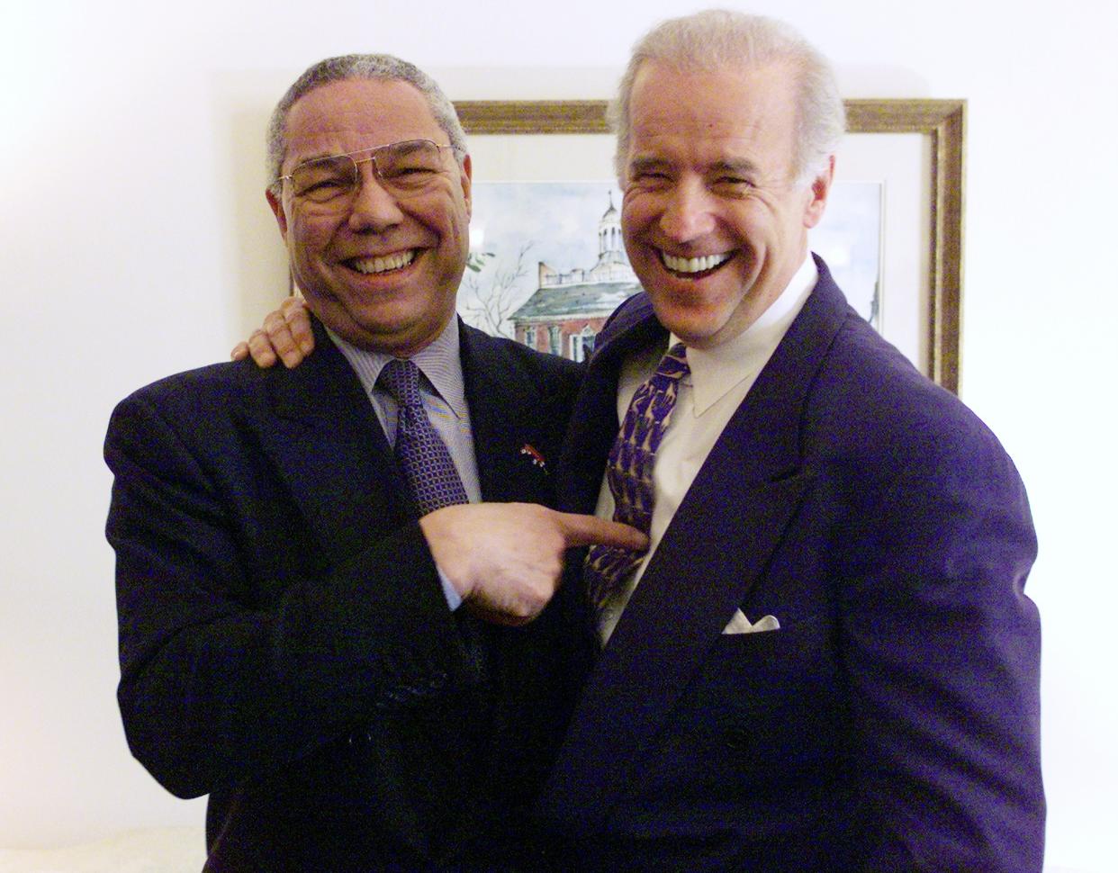 Colin Powell, then the secretary of state-designate, smiles during a meeting with then-Sen. Joe Biden on Capitol Hill in 2000. (Photo by Harry Hamburg/NY Daily News Archive via Getty Images)