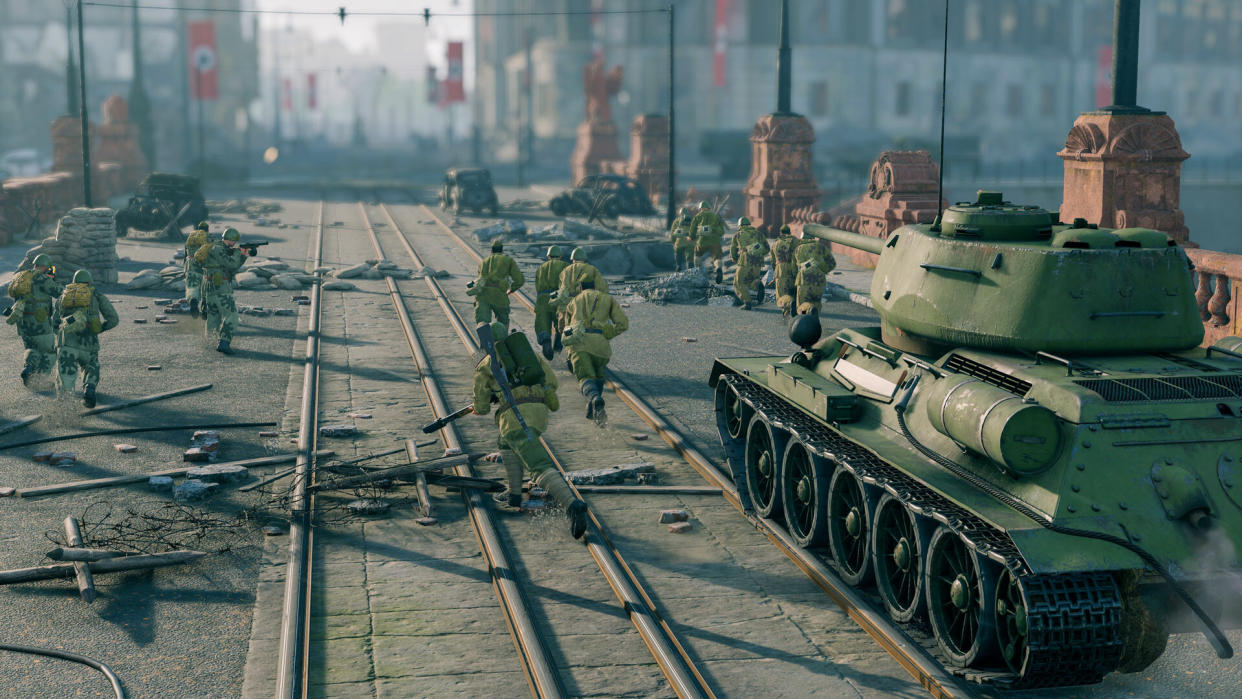  A screenshot of World War 2 soviet soldiers crossing a bridge with a tank from shooter Enlisted. 