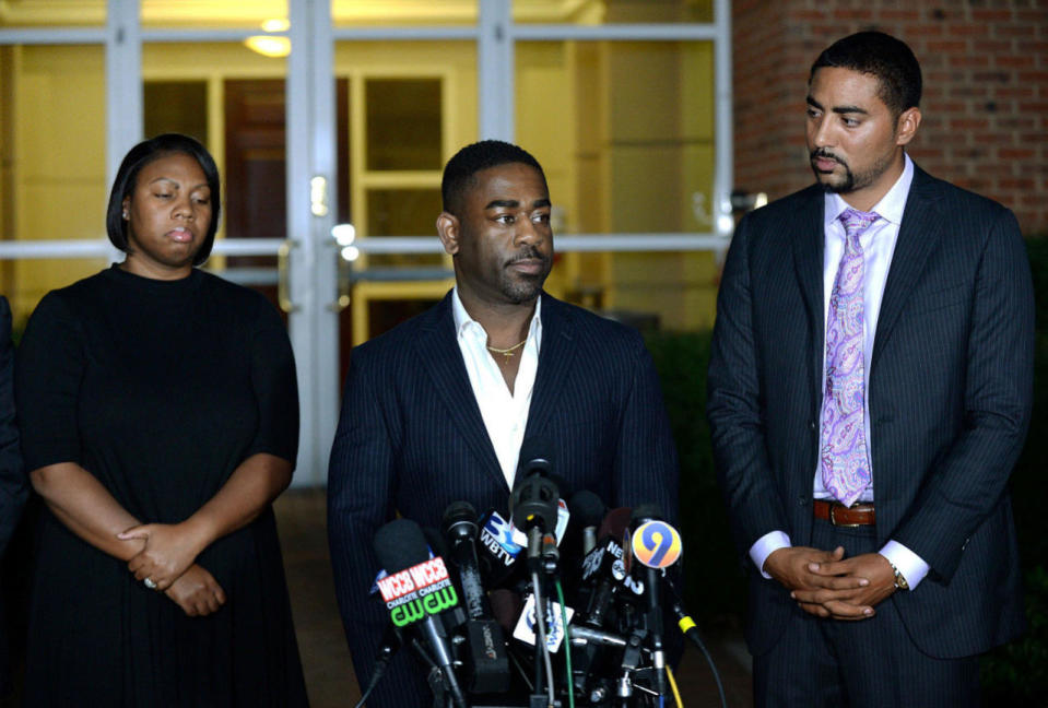 <p>Rachel, left, and Ray Dotch, center, sister-in-law and brother-in-law to Keith Lamont Scott, give a news conference in Charlotte, N.C., on Saturday, Sept. 24, 2016. At right is the family’s attorney, Justin Bamberg. Scott was fatally shot by Charlotte-Mecklenburg Police Officer Brentley Vinson on Tuesday. Dotch objected to reporters’ questions about Scott’s background, saying he shouldn’t have to “humanize in order for him to be treated fairly.” (Jeff Siner/The Charlotte Observer via AP)</p>