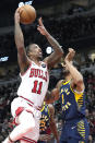 Chicago Bulls forward DeMar DeRozan, left, drives to the basket against Indiana Pacers forward Obi Toppin during the first half of an NBA basketball game in Chicago, Wednesday, March 27, 2024. (AP Photo/Nam Y. Huh)