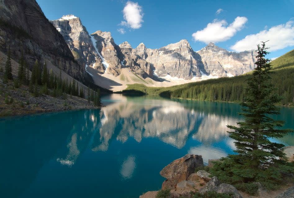 In 2023, private vehicles were banned from the road to Moraine Lake. From June to mid-October, access to the lake was provided by Parks Canada Shuttle, Roam Transit, commercial buses and taxis. (dbarronoss/Flickr - image credit)