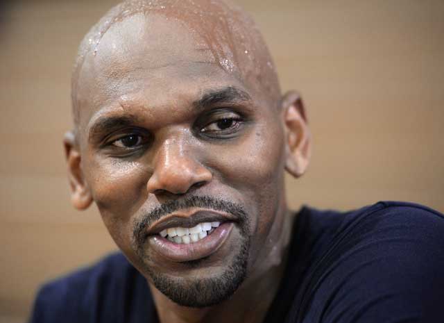 Jerry Stackhouse talks to reporters in the Kinston High School gym, where he starred as a Viking before and becoming an All-American at UNC and an NBA All-Star, Friday after a pick-up basketball game.