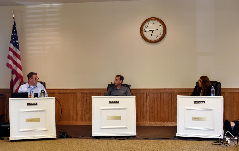 Etna Township trustees Mark Evans, Jeff Johnson and Rozland McKee-Flax talk during an Etna Township Trustees meeting on Tuesday, July 19, 2022, at the Etna Township Administration Building. The trustees have spent much of 2022 arguing about matters big and small — from whether to hire a full-time township administrator to the township hall décor.