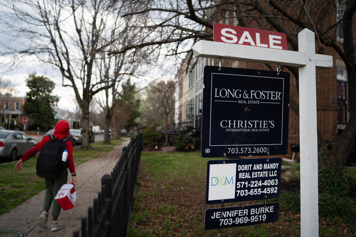 A child walks past a home for sale on G St. SE. The neighborhood of Hill East is between Capitol Hill and the Anacostia River and straddles the borders of Northeast and Southeast Washington. (Photo by Sarah L. Voisin/The Washington Post via Getty Images)