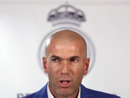 Real Madrid's new coach Zinedine Zidane appears before the media at Santiago Bernabeu stadium in Madrid, Spain, January 4, 2016. REUTERS/Juan Medina