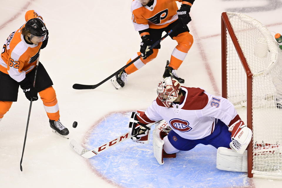 Montreal Canadiens goaltender Carey Price (31) stops Philadelphia Flyers right wing Nicolas Aube-Kubel (62) during the second period of an NHL Eastern Conference Stanley Cup hockey playoff game in Toronto, Friday, Aug. 14, 2020. (Frank Gunn/The Canadian Press via AP)