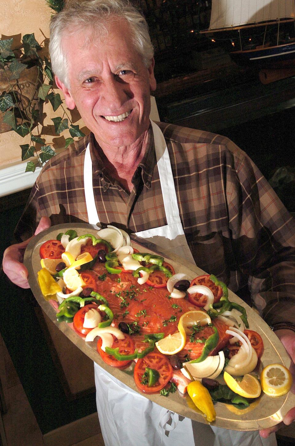 Nick Voulgaris--Olympia holds his favorie family dish Staff Photo BY KEN BLEVINS / WILMINGTON STAR NEWS