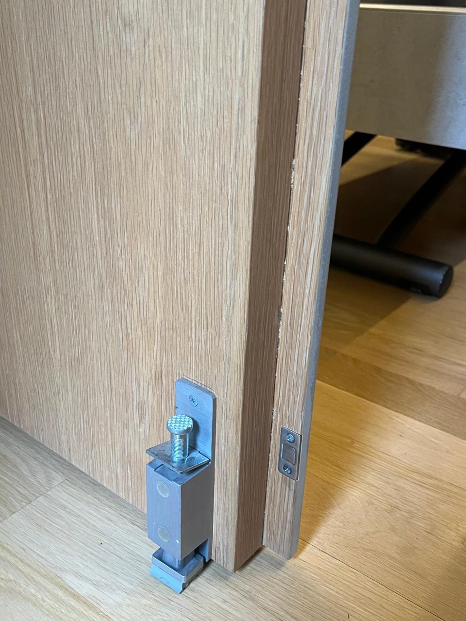 A bolt that keeps the swinging wall in place when the bedroom is open. 