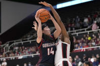 Gonzaga guard Kaylynne Truong (14) is fouled by Stanford guard Agnes Emma-Nnopu during the first half of an NCAA college basketball game in Stanford, Calif., Sunday, Dec. 4, 2022. (AP Photo/Tony Avelar)