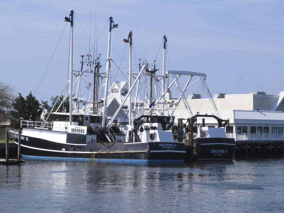 Fishing boats sit at the dock in Point Pleasant Beach, N.J. on Sept. 11, 2019. A report issued March 29, 2023 by two federal marine science agencies and the commercial fishing industry highlighted several potential negative aspects of offshore wind energy development on the fishing industry and called for additional research. (AP Photo/Wayne Parry)