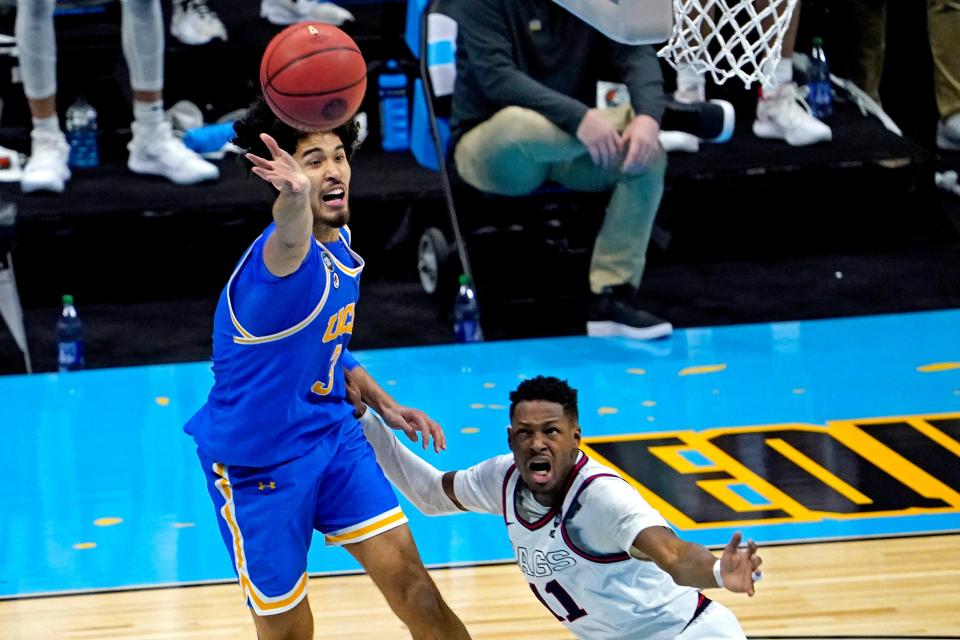 Apr 3, 2021; Indianapolis, Indiana, USA; UCLA Bruins guard Johnny Juzang (3) and Gonzaga Bulldogs guard Joel Ayayi (11) go for the ball during the second half in the national semifinals of the Final Four of the 2021 NCAA Tournament at Lucas Oil Stadium. Mandatory Credit: Robert Deutsch-USA TODAY Sports ORG XMIT: IMAGN-450929 ORIG FILE ID:  20210403_pjc_usa_279.JPG