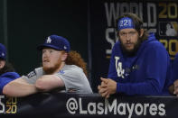 Los Angeles Dodgers starting pitcher Dustin May and starting pitcher Clayton Kershaw watch during the ninth inning in Game 5 of the baseball World Series against the Tampa Bay RaysSunday, Oct. 25, 2020, in Arlington, Texas. (AP Photo/Tony Gutierrez)