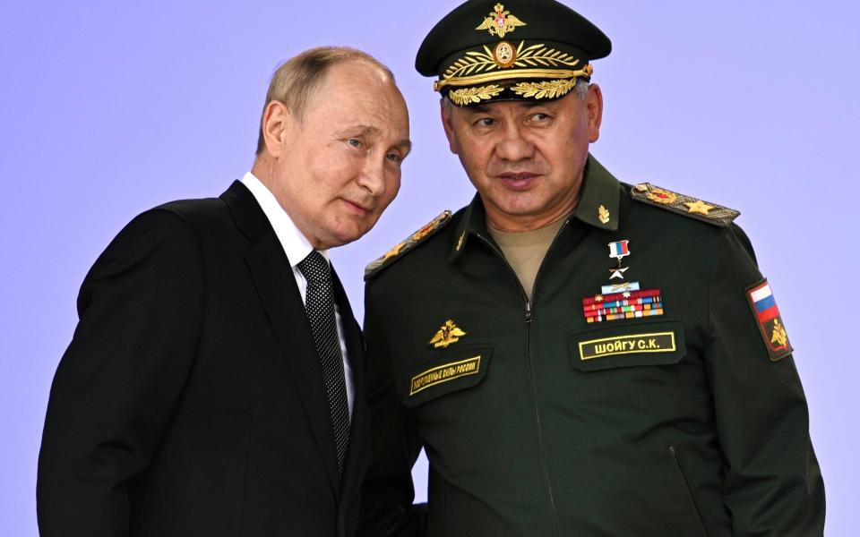 Vladimir Putin with Sergei Shoigu, the Russian defence minister - Pool Sputnik Kremlin