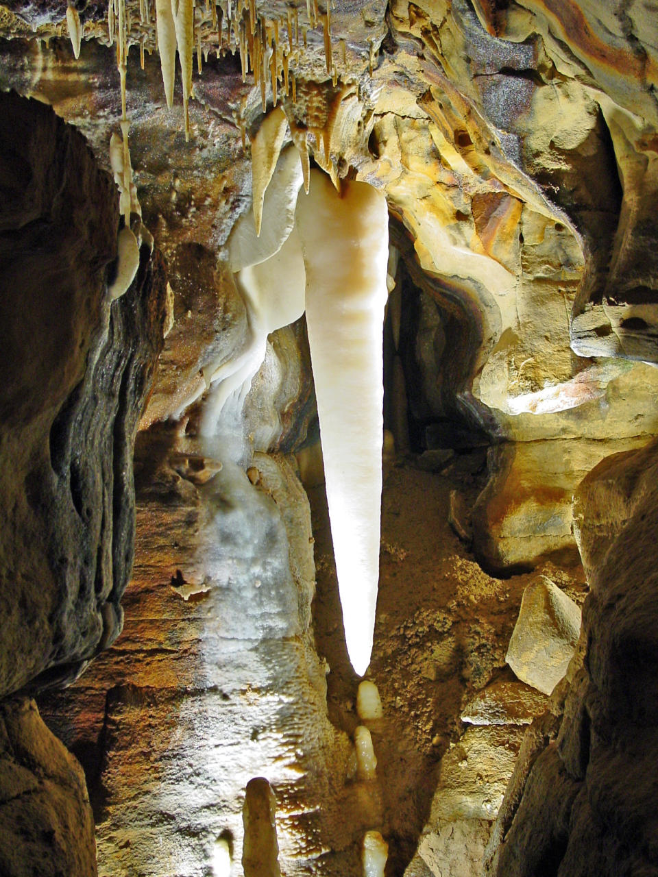 This undated photo provided by Ohio Caverns in West Liberty, Ohio, shows the nearly five foot long Crystal King stalactite. Sections of the state's largest cave system, discovered in 1897, that haven't been seen by the public will open beginning Memorial Day weekend - increasing the amount of surveyed passageways to 3 1-2 miles. (AP Photo/Ohio Caverns)