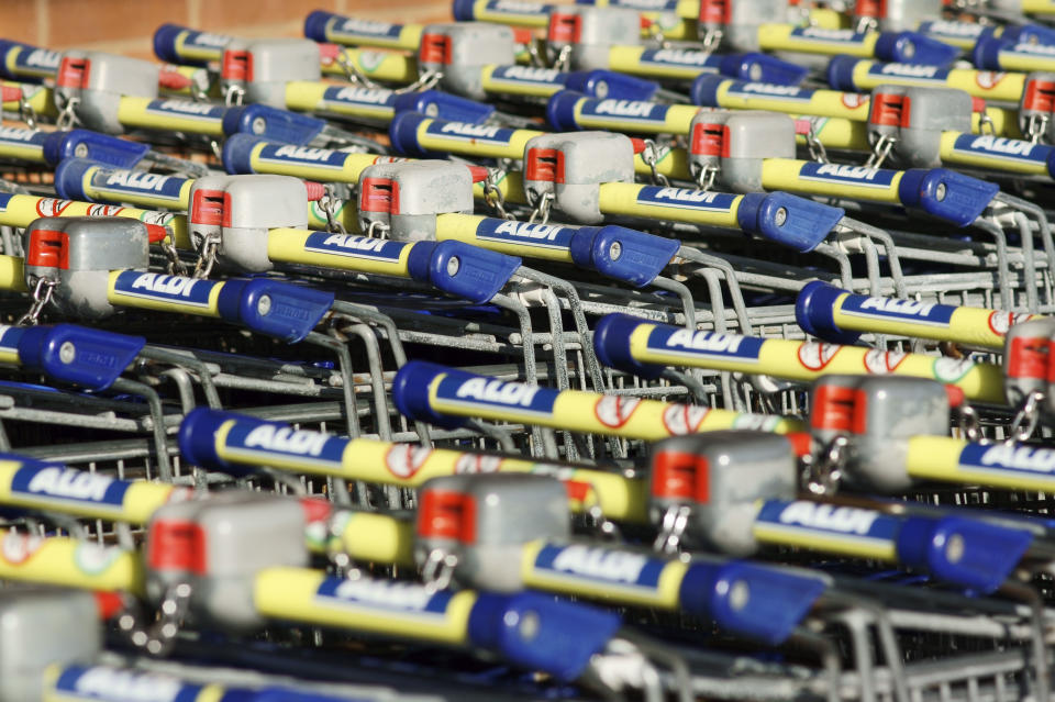 Seaham, England - March 6, 2011: Rows of trolley belonging to the popular Aldi supermarket chains are waiting unused in the sun.