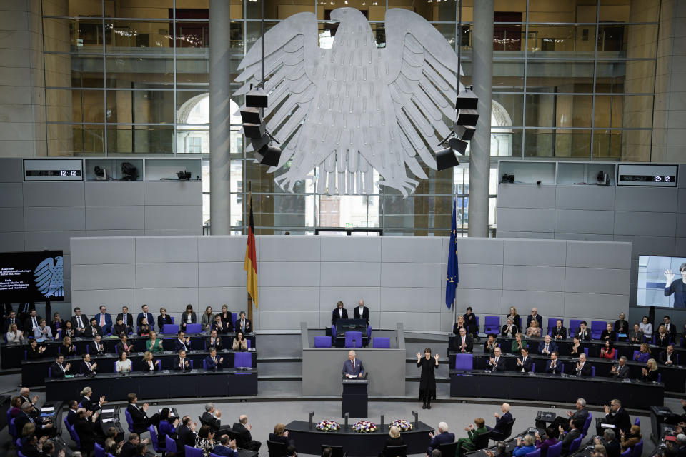 Britain's King Charles III, center, addresses the Bundestag, Germany's Parliament, in Berlin, Thursday, March 30, 2023. King Charles III arrived Wednesday for a three-day official visit to Germany. (AP Photo/Markus Schreiber)