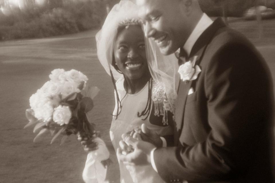 smiling bride and groom