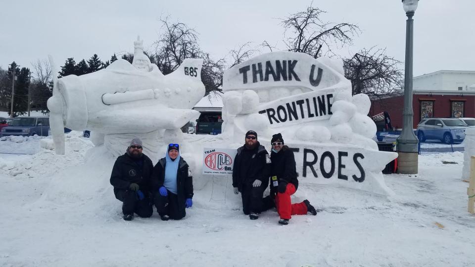Artists thank frontline workers for their efforts during the COVID-19 pandemic with an enormous snow sculpture in 2021.