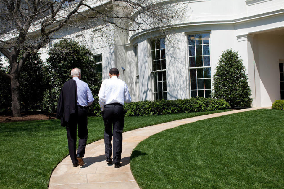 Obama and Biden walk back to the Oval Office after putting on the White House putting green on April 24, 2009.