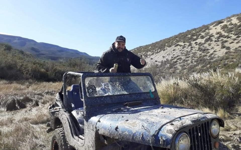 Diego Barra, 32, poses on a jeep. His remains were found inside a shark caught by fishermen in the area where he disappeared in Chubut, Argentina. - Newsflash