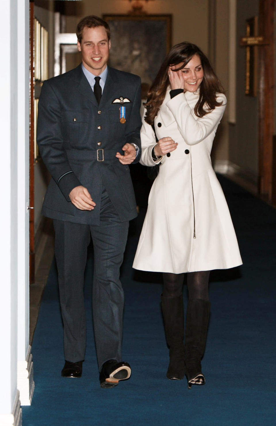 William <a href="http://edition.cnn.com/2008/WORLD/europe/04/11/prince.william/index.html" target="_blank" rel="noopener noreferrer">receives his Royal Air Force wings</a> at a graduation ceremony in April 2008. Kate is by his side to celebrate the accomplishment.