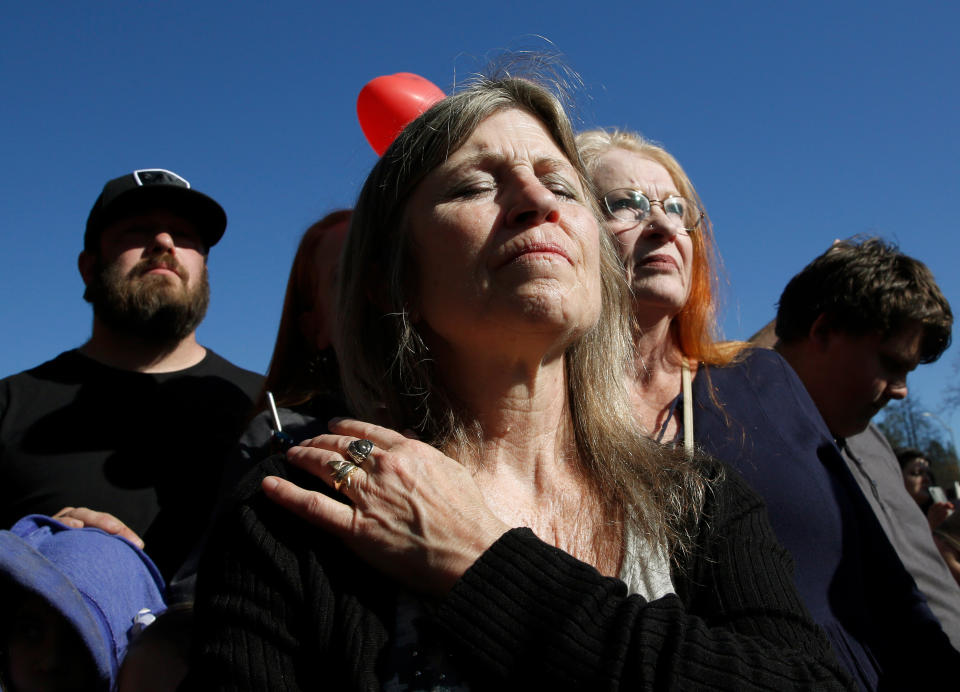 Tami Neves closes her eyes during ceremonies of the one year anniversary of the Camp Fire, held in Paradise, Calif., Friday, Nov. 8, 2019. Neves lost her business in the fire and other family members lost their homes. (AP Photo/Rich Pedroncelli)