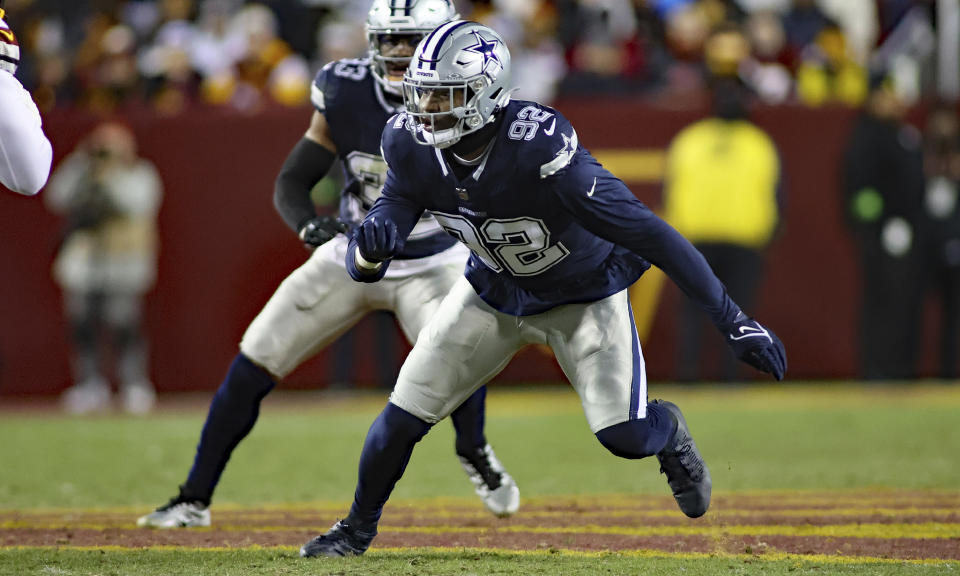 FILE - Dallas Cowboys defensive end Dorance Armstrong (92) runs during an NFL football game against the Washington Commanders, Sunday, Jan. 7, 2024, in Landover, Md. The Washington Commanders have agreed to deals with center Tyler Biadasz and defensive lineman Dorance Armstrong, according to two people familiar with the agreements. The people spoke to The Associated Press on condition of anonymity Monday, March 11, 2024, because the contracts cannot be made official until the new league year opens Wednesday.(AP Photo/Daniel Kucin Jr., File)