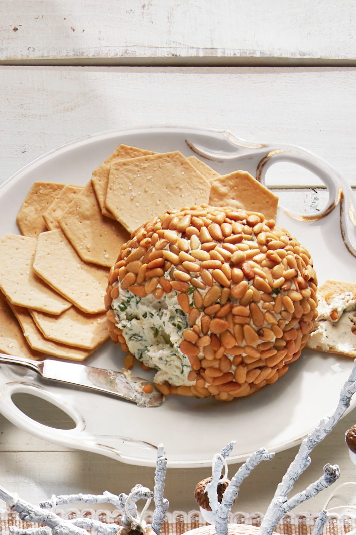 <p>Your appetizer table needs this cheese ball packed with flavorful herbs and coated in crunchy pine nuts.</p><p><strong><a href="https://www.countryliving.com/food-drinks/a29641000/herbed-cheese-ball-recipe/" rel="nofollow noopener" target="_blank" data-ylk="slk:Get the recipe;elm:context_link;itc:0;sec:content-canvas" class="link ">Get the recipe</a>.</strong></p><p><strong><a class="link " href="https://www.amazon.com/Boska-Holland-357615-Copenhagen-Collection/dp/B06WWN6SDY/?tag=syn-yahoo-20&ascsubtag=%5Bartid%7C10050.g.34470406%5Bsrc%7Cyahoo-us" rel="nofollow noopener" target="_blank" data-ylk="slk:SHOP CHEESE KNIVES;elm:context_link;itc:0;sec:content-canvas">SHOP CHEESE KNIVES</a><br></strong></p>