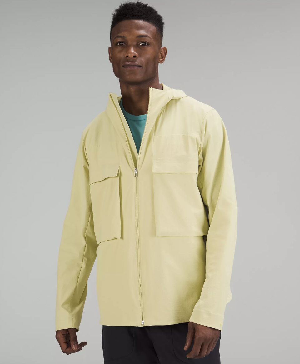 man wearing light green Stretch Cargo Jacket (photo via Lululemon)